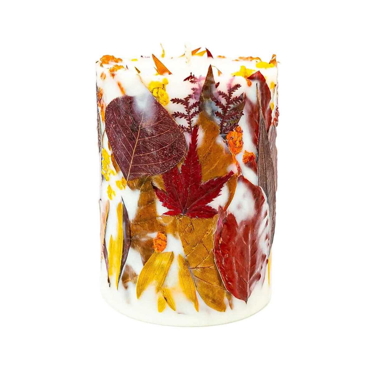 Autumn botanical soy wax pillar candle with red maple leaves, burgundy foliage and yellow wildflowers on a white background.