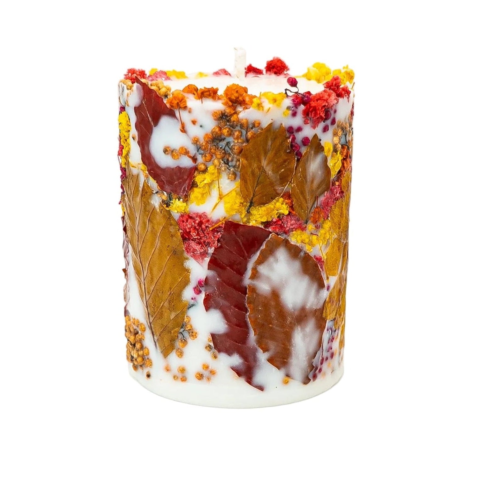Handmade autumn pillar candle decorated with a dried sunflower, colourful flowers and autumn leaves.