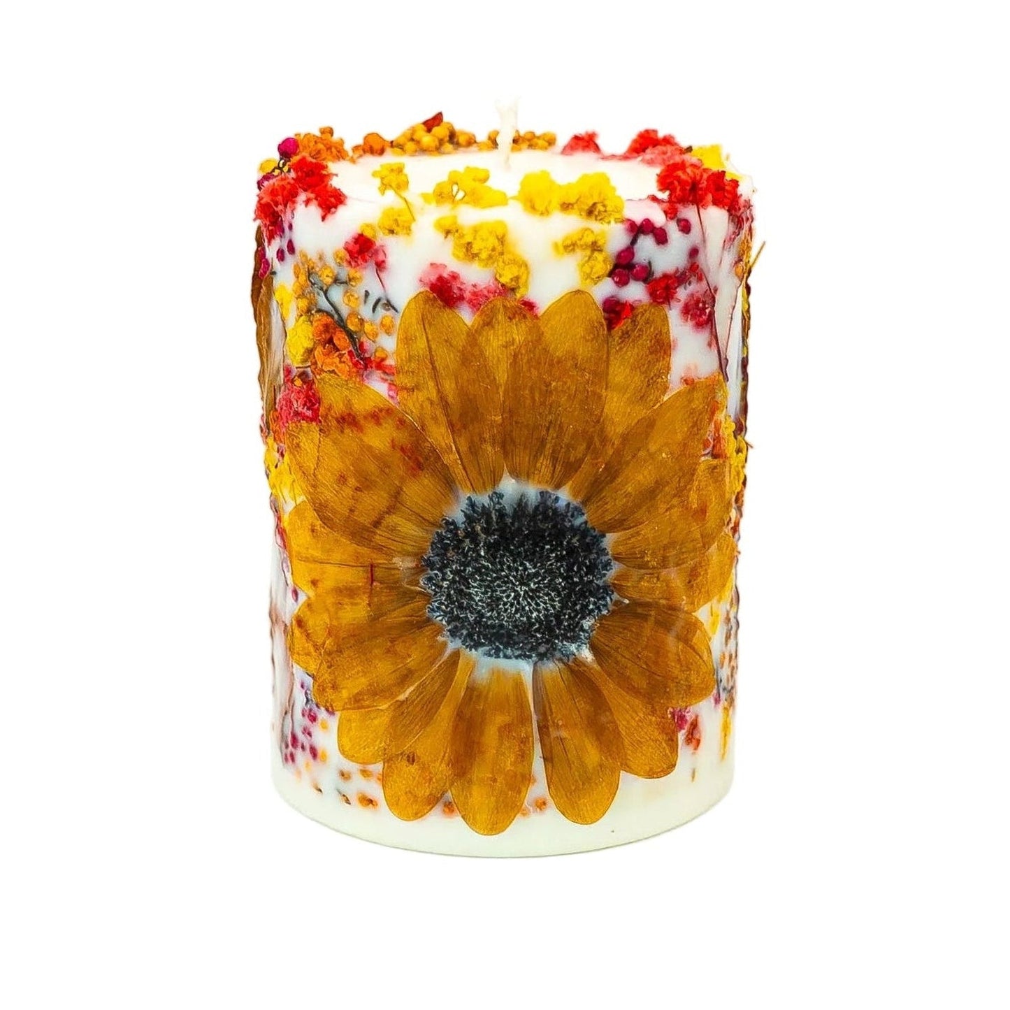 Handmade autumn botanical soy wax pillar candle featuring a dried sunflower, autumn leaves and colourful wildflowers.