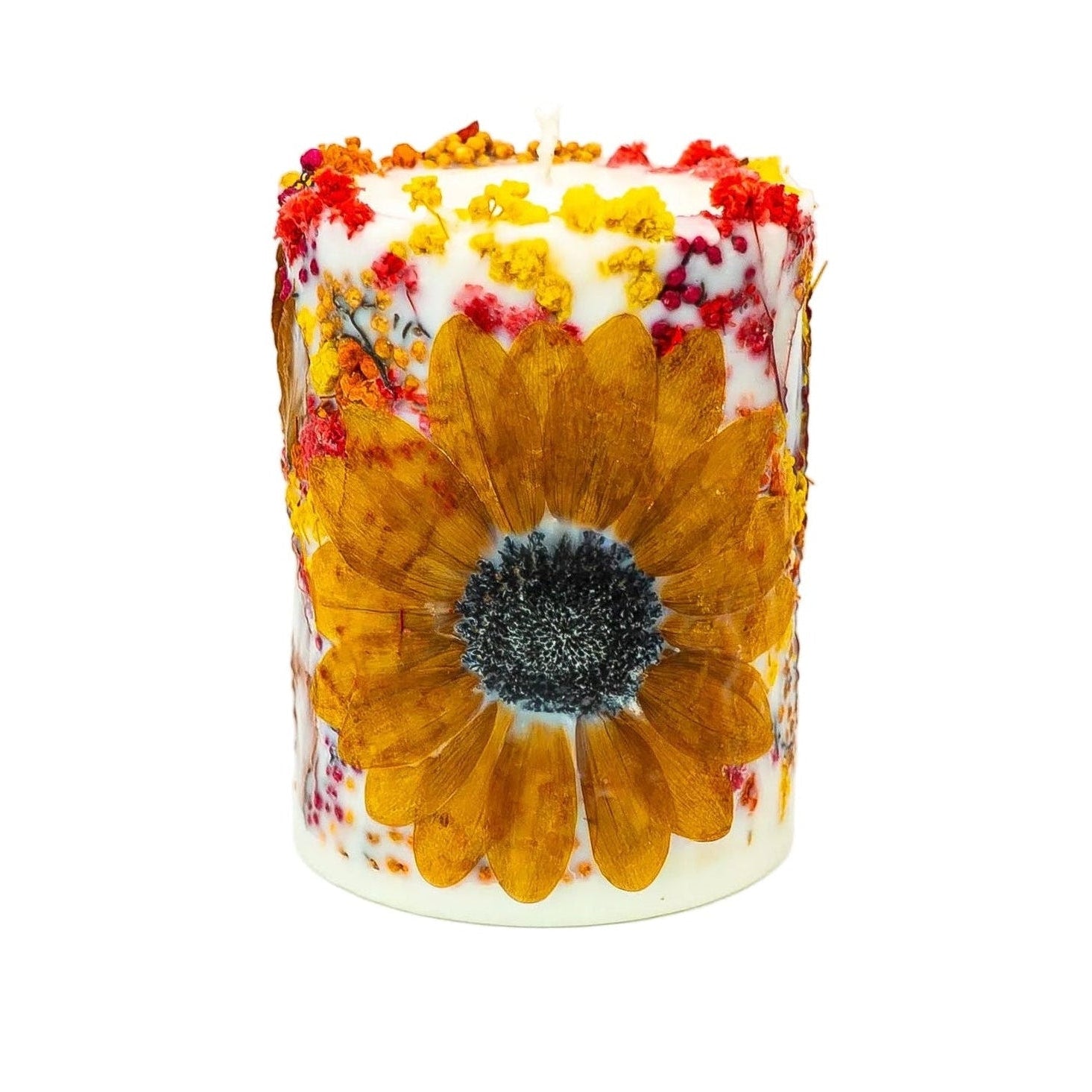 Handmade autumn botanical soy wax pillar candle featuring a dried sunflower, autumn leaves and colourful wildflowers.