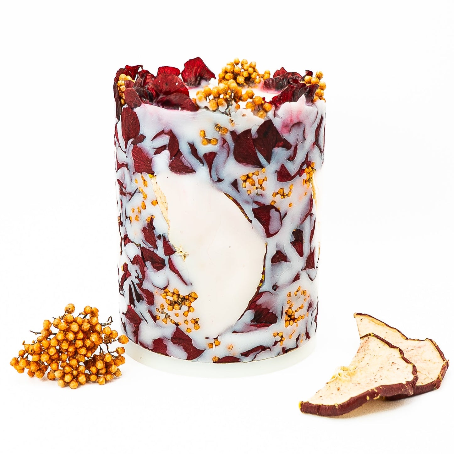 Botanical soy wax pillar candle with real hydrangea petals and dried red apple slices.