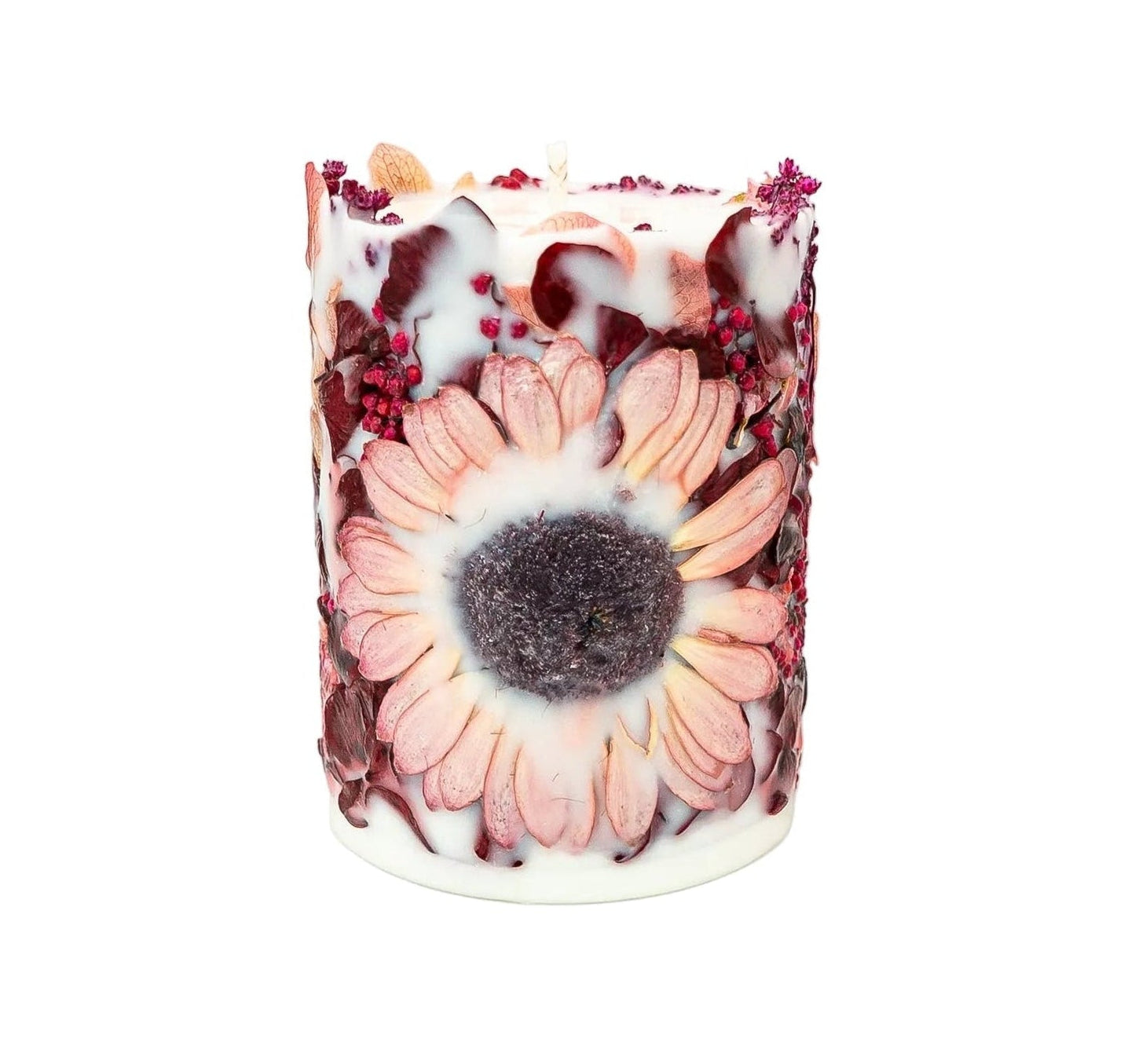 Handmade botanical soy wax pillar candle with a real dried Gerbera, hydrangea and burgundy botanicals on a white background.