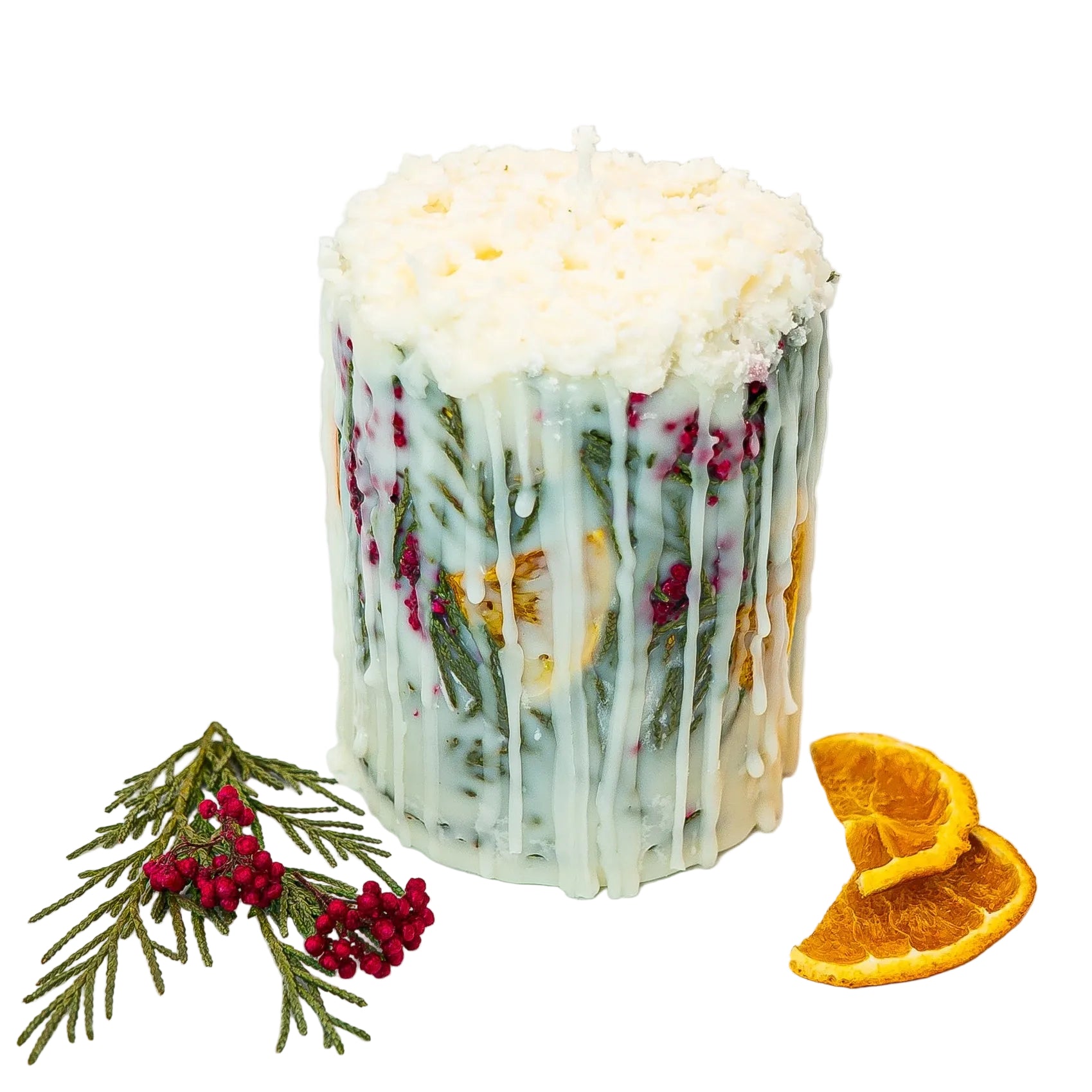 Decorative botanical pillar candle with dried oranges, evergreen foliage, and natural soy wax.