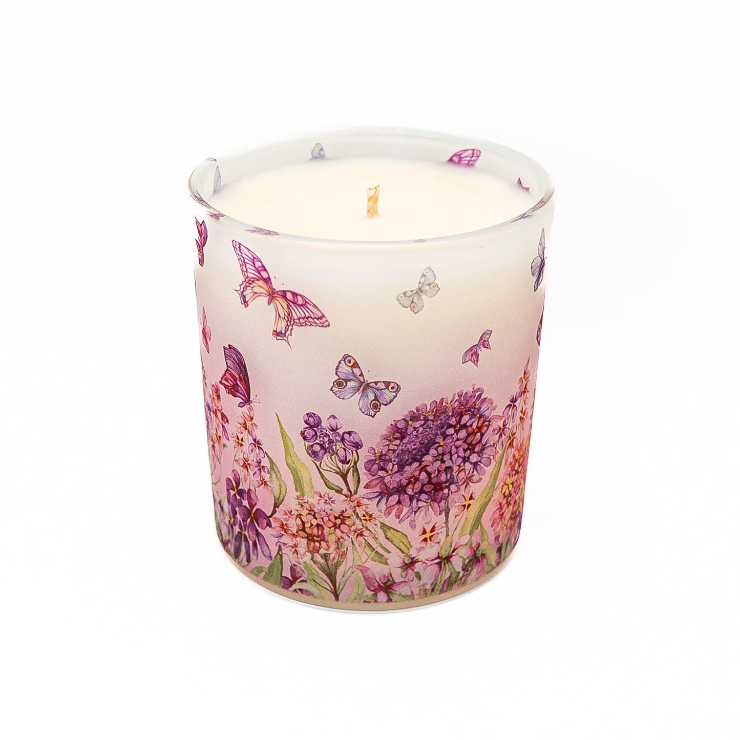 Hand-poured soy wax candle in frosted glass jar with butterfly garden floral pattern and bamboo lid.