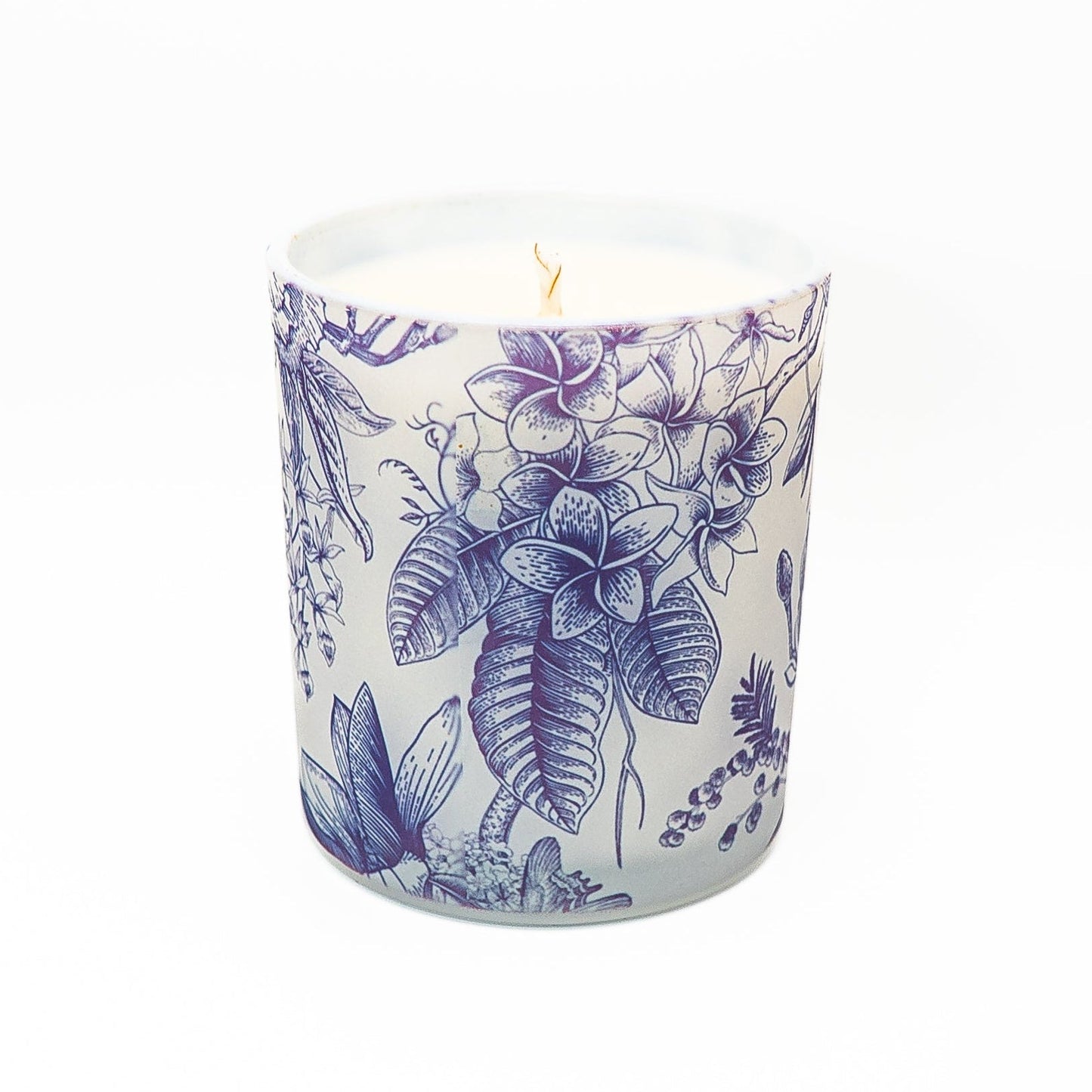 Decorative blue botanical soy wax candle in a glass container with bamboo lid and detailed floral illustration design.
