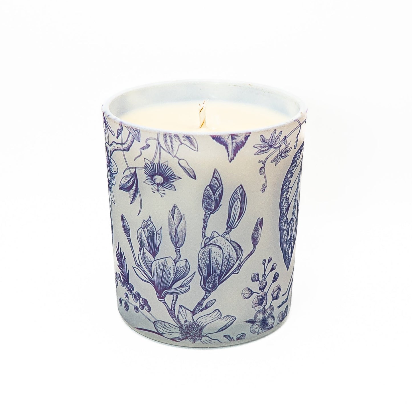 Blue floral botanical candle in a frosted glass jar with soy wax and bamboo lid for elegant home décor.