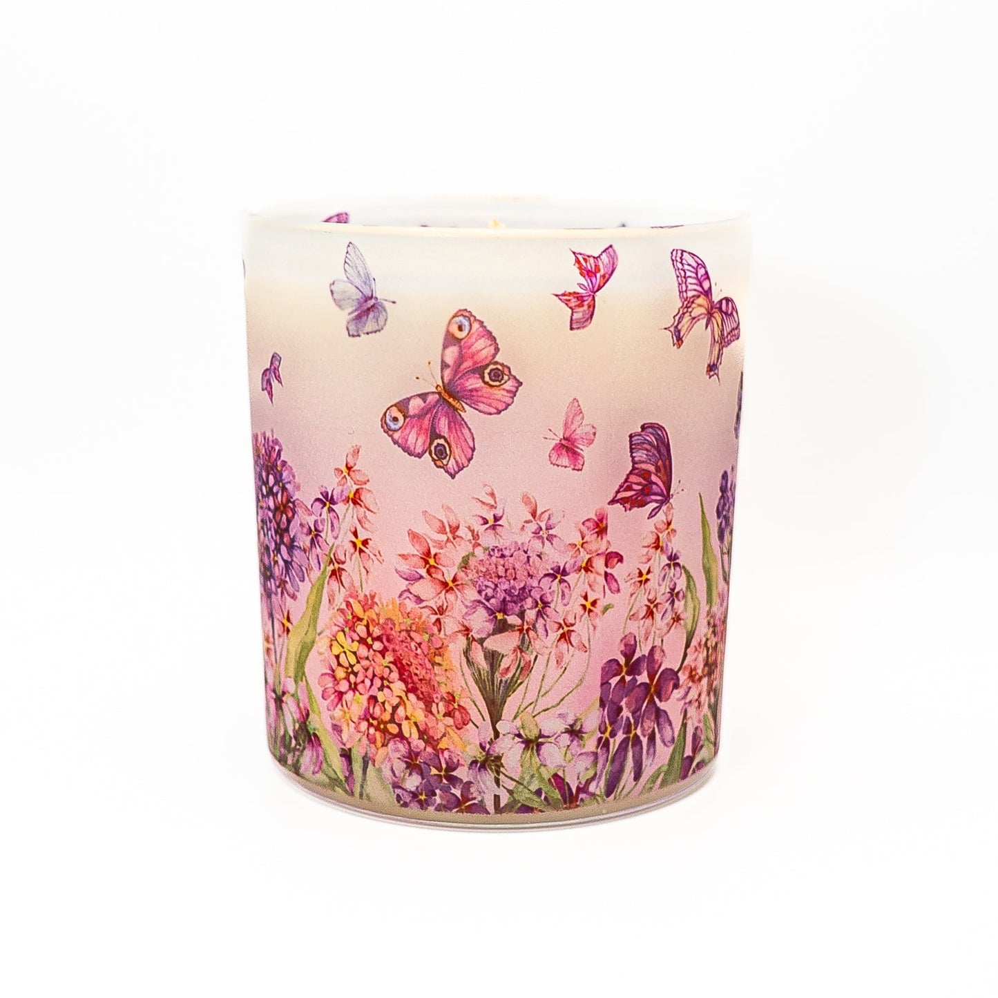 Decorative hand-poured soy wax candle in frosted glass jar with butterfly and flower illustration.