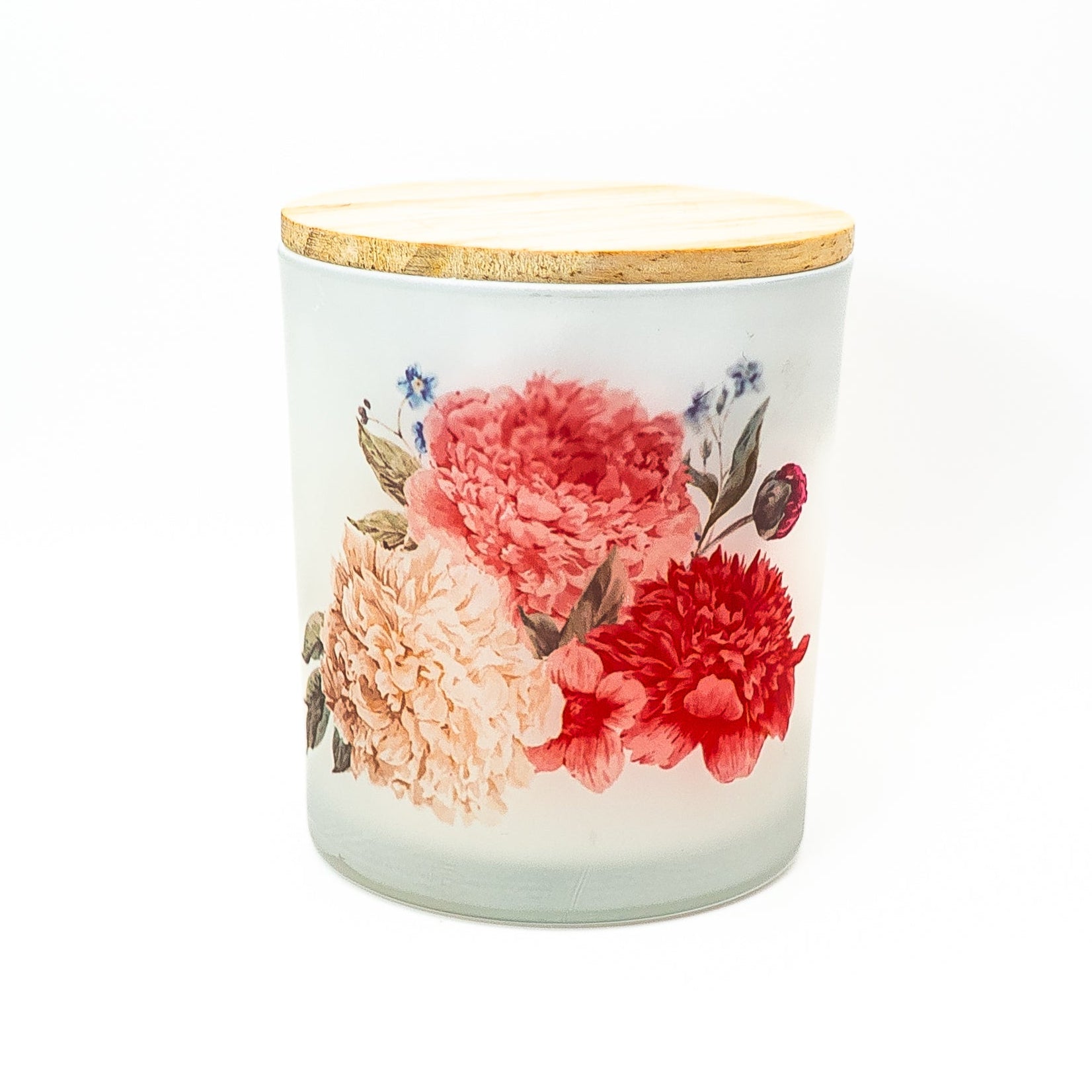 Hand-poured soy wax candle in a frosted glass jar with floral design and bamboo lid.