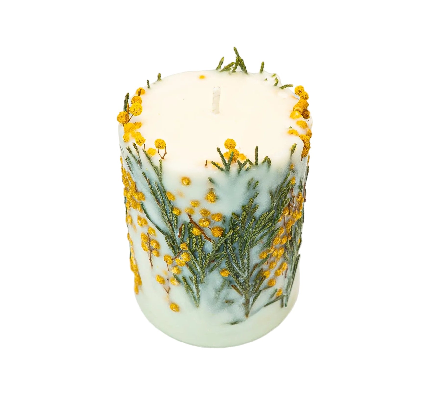 Handmade soy wax candle with yellow mimosa blooms and green foliage on white background.