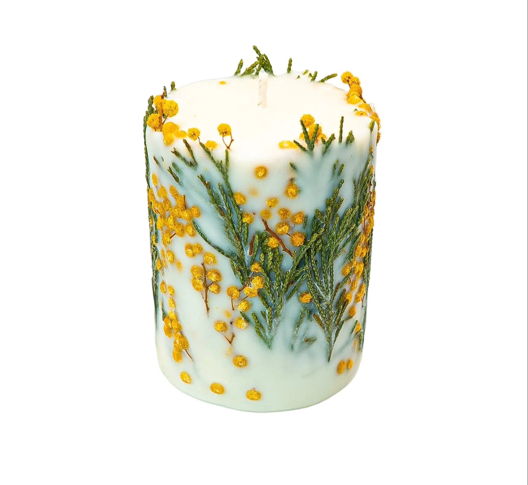 Natural soy wax pillar candle embedded with yellow mimosa flowers and green botanicals