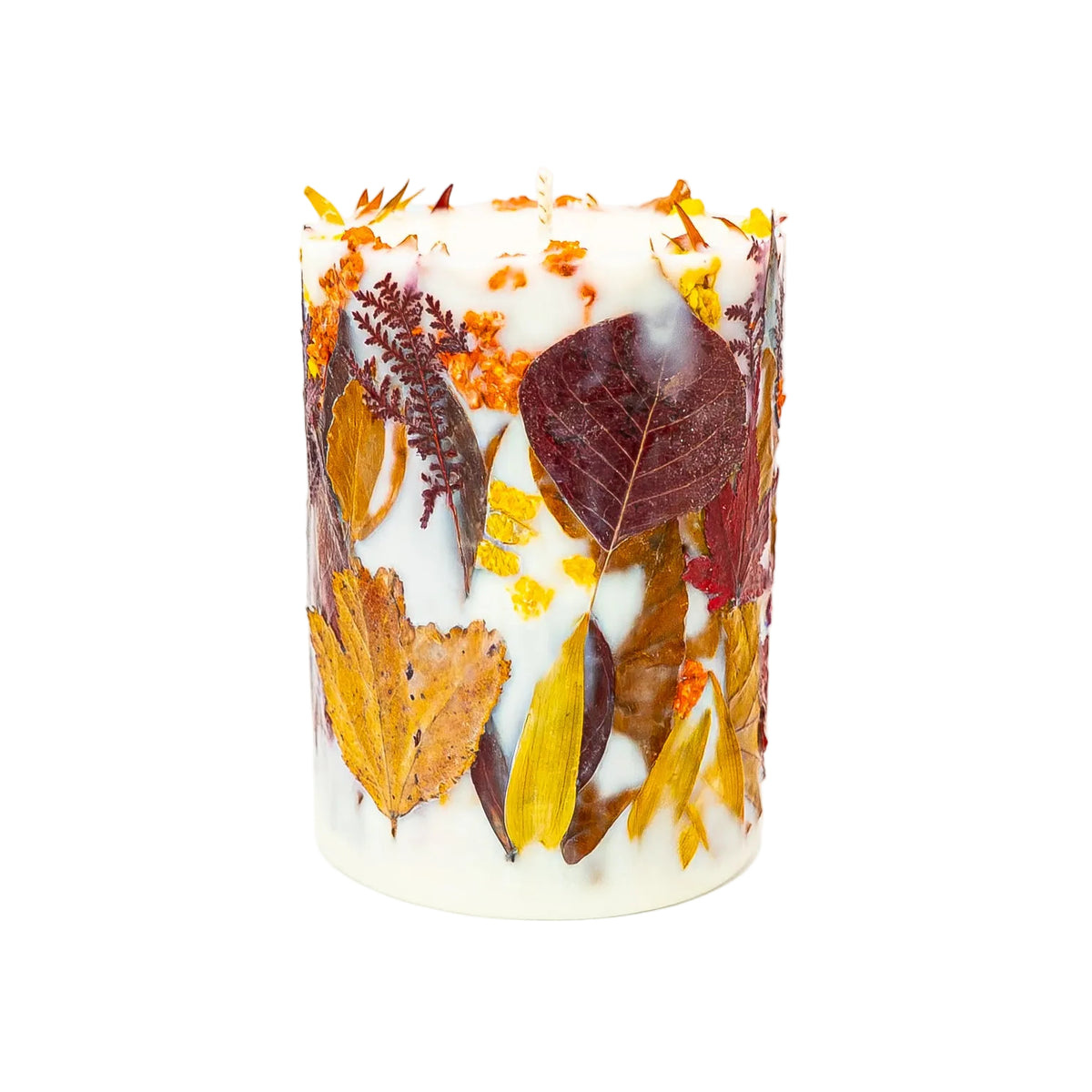 Autumn pillar candle with deep burgundy leaves, delicate stems and yellow wildflowers embedded in soy wax.