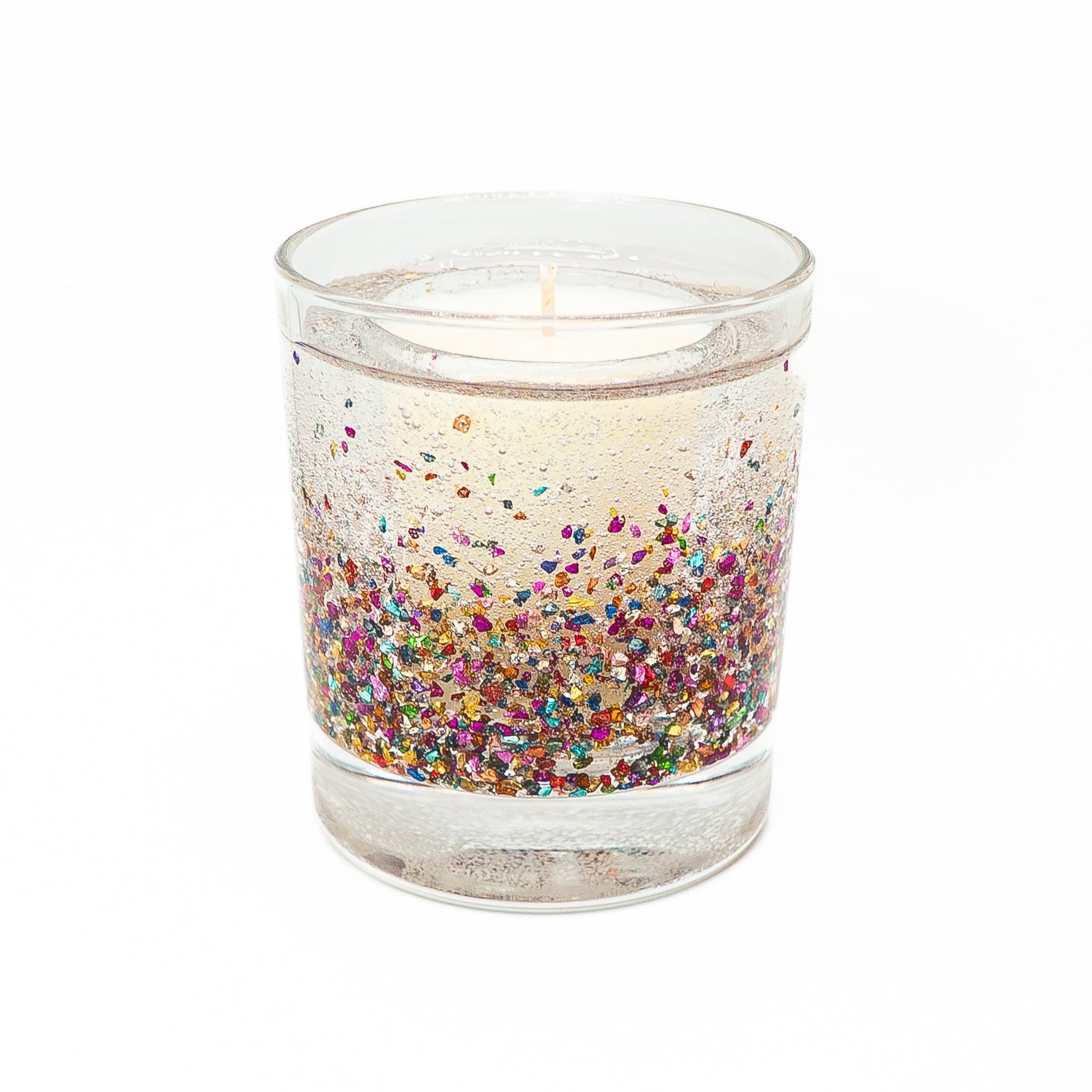 Sparkling candle with glitter-filled gel wax outer layer surrounding a soy wax candle core.